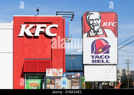 Seattle - February 06, 2022; Signs for KFC and Taco Bell fast food restaurants in Seattle Stock Photo