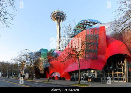 Seattle - February 06, 2022; Modern building housing the Museum of Pop Culture or MoPOP in front of the Seattle Space Needle in morning light Stock Photo