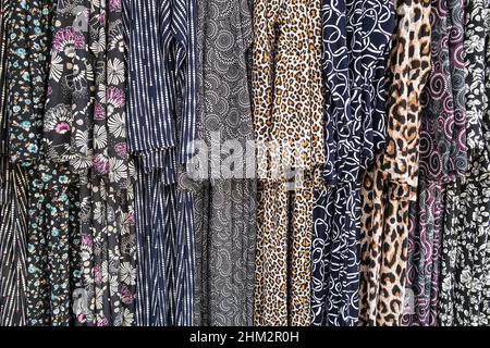 Muslim womens long dress in different patterns for sale. Stock Photo