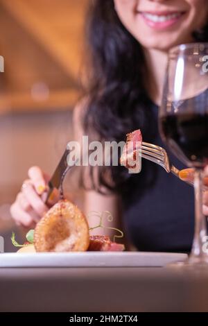 Slow cooked pork collar, cabbage, five spices, apple condiment, fine dining with a red wine Stock Photo