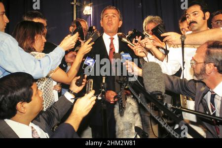 Texas Gov. George W. Bush talks to reporters at Republican convention. ©Bob Daemmrich Stock Photo