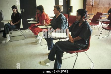 Austin, Texas USA  1992: Remedial writing and reading class for female inmates at the Travis County Jail.  No model releases available.  ©Bob Daemmrich Stock Photo