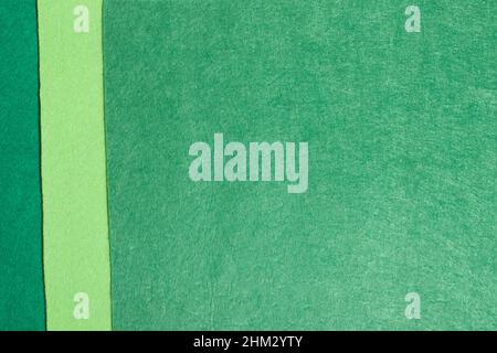 The background is made of felt in three shades of green Stock Photo
