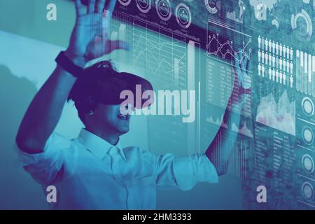 business man using VR technology display visual business hologram information Stock Photo