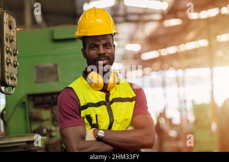 Portrait smart Black African worker work in heavy industry factory with safety clothes equipments Stock Photo