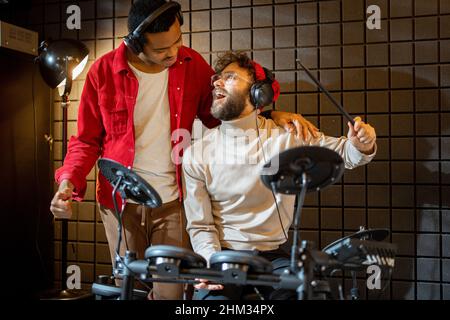 Men playing electric drums at home sstudio Stock Photo
