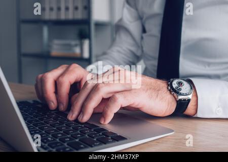 Data typing and administration office worker using laptop computer, selective focus Stock Photo