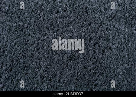 Carpet texture background. Black gray cotton carpet for floor coverings. Material for interior design and decoration of living rooms. High quality photo Stock Photo