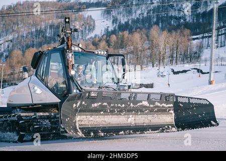 Close up of the Snowcat 'Prinoth' Caterpillar vehicle for maintenance of mountain ski slopes. Stock Photo