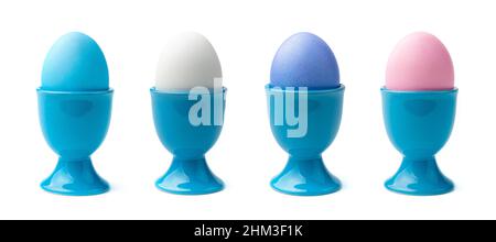 A set of colored eggs on a stand isolated on a white background. Side view. The concept of a Happy Easter. Stock Photo