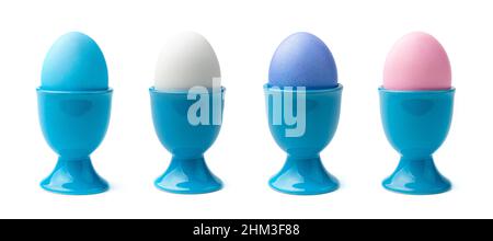 A set of colored eggs on a stand isolated on a white background. Side view. The concept of a Happy Easter. Stock Photo
