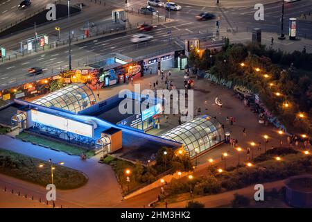 Warsaw, Poland - June 18, 2021: Patelnia square at Marszalkowska street, entrance to metro station Centrum at night in the city centre. Stock Photo