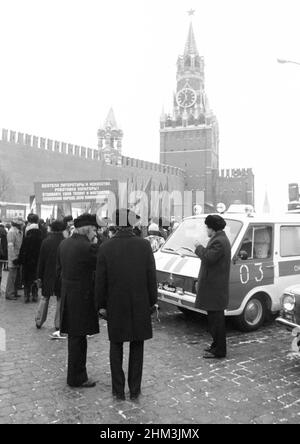 The 60th anniversary of the October Revolution. People come out of Red Square after the parade. Moscow, Russia, USSR, November 7, 1977 Stock Photo