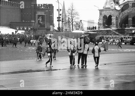 The 60th anniversary of the October Revolution. People come out of Red Square after the parade. Moscow, Russia, USSR, November 7, 1977 Stock Photo