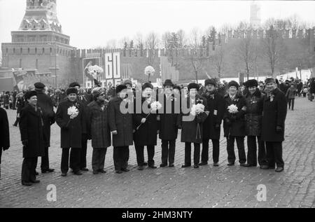 The 60th anniversary of the October Revolution. People come out of Red Square after the parade. Moscow, Russia, USSR, November 7, 1977 Stock Photo