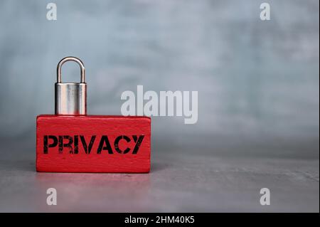 Close up image of padlock on wooden cube with text PRIVACY. Copy space for text Stock Photo