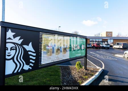 Starbucks Drive Thru,Starbucks,Starbucks coffee,Starbucks drive through,drive through,Starbucks sign,Starbucks building,coffee,starbucks coffee shop, Stock Photo