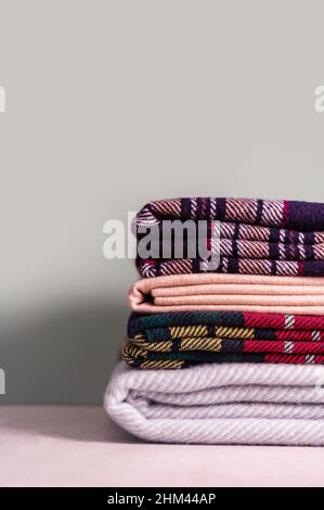Stack of woolen checked blankets Stock Photo