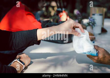 Woman hand picked wet wipes in package health care and medicine concept. Stock Photo