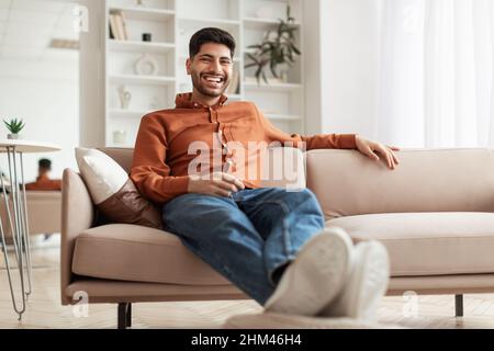 Man having rest at home on the couch Stock Photo