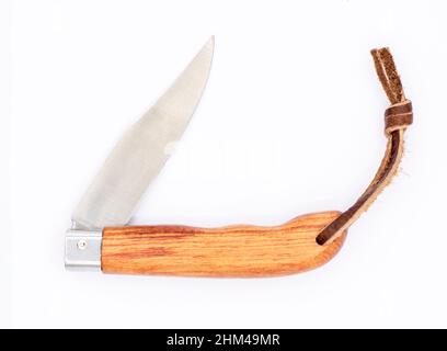 Wood handle folding knife isolated on white background. Stock Photo