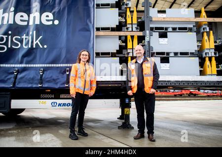 Bremen, Germany. 07th Feb, 2022. Sigrid Nikutta (l), Chairwoman of the Management Board of DB Cargo, and Jörg Burzer, Member of the Board of Management of Daimler AG and Mercedes-Benz AG responsible for Production and Supply Chain Management, stand in front of a trailer loaded with car batteries on the DB Cargo site. The new Automotive Logistics Center on the DB Cargo rail site will be used in future to transport the drive batteries and vehicle components for Mercedes-Benz electric vehicles at the Bremen plant site. Credit: Hauke-Christian Dittrich/dpa/Alamy Live News Stock Photo