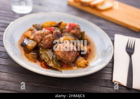 steamed meatballs with stewed vegetables on plate Stock Photo