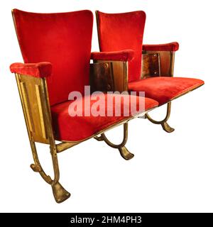 Two vintage red movie theater chairs isolated on a white background Stock Photo