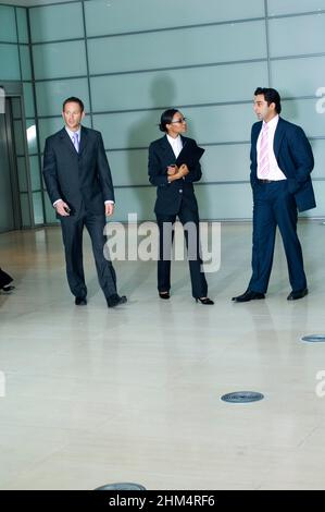 Three Business Executives Standing Side By Side, Credit:Photoshot Creative / Stuart Cox / Avalon Stock Photo