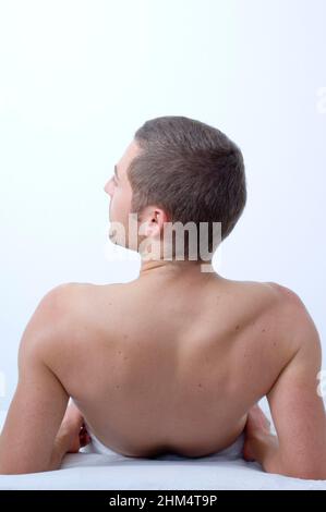 Rear View Of A Young Man Laying On His Back, Credit:Photoshot Creative / Stuart Cox / Avalon Stock Photo