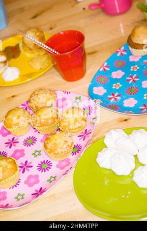 High Angle View Of Cupcakes With Burger And Other Food Items, Credit:Photoshot Creative / Stuart Cox / Avalon Stock Photo