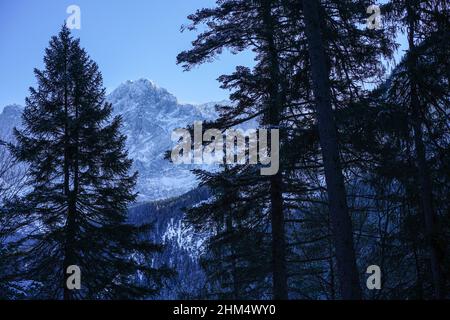 View from the shore of the Eibsee to the Zugspitze, Germany's highest mountain. Stock Photo