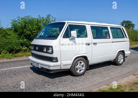 2000 White VW Volkswagen Microbus 2553cc petrol; en-route to Capesthorne Hall classic July car show, Cheshire, UK Stock Photo