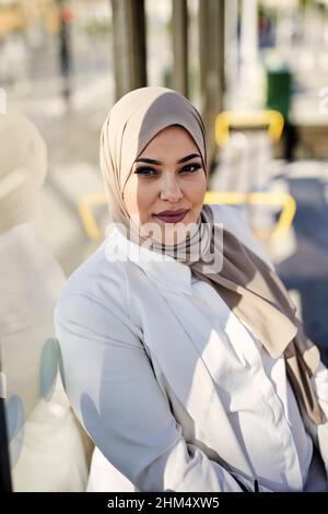 Smiling woman looking at camera Stock Photo