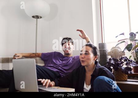 Young couple in living room Stock Photo