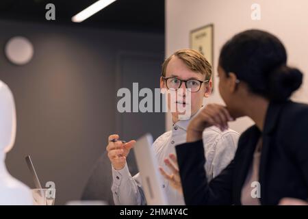 Business people having meeting in boardroom Stock Photo