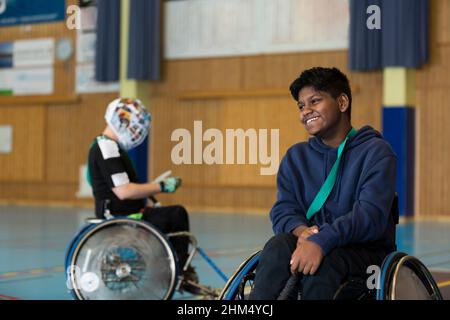 Disabled people playing in gym Stock Photo