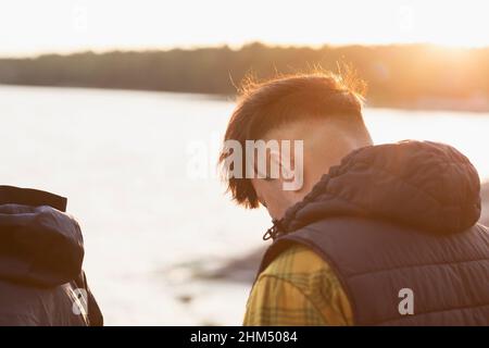 Man sitting at sea Stock Photo