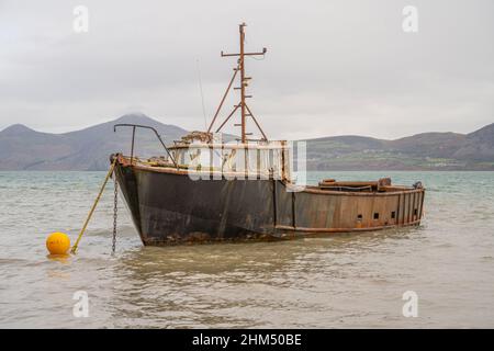 Moored boat at Traeth Porthdinllaen on the Llyn Peninsula Wales on a winters day Stock Photo