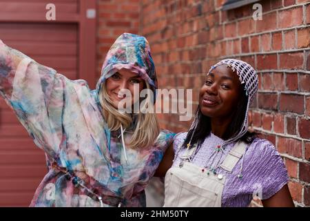 Female friends looking at camera Stock Photo