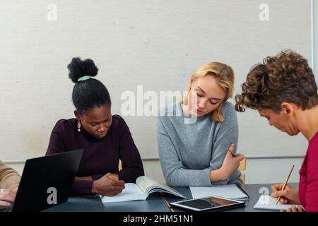 Students learning in classroom Stock Photo