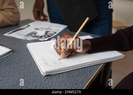 Hand writing in notepad Stock Photo