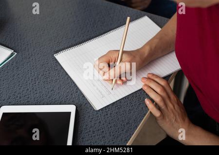 Hand writing in notepad Stock Photo
