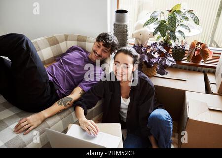 Young couple in living room Stock Photo