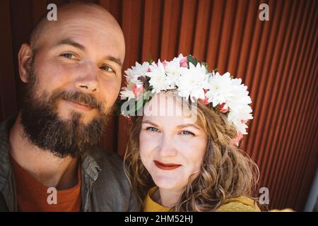 Portrait of smiling couple looking at camera Stock Photo