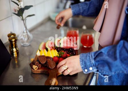 Woman's hands arranging healthy snacks Stock Photo