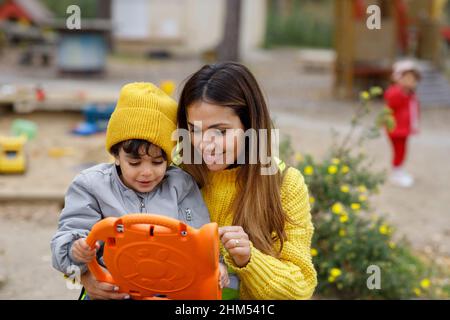 Woman with son using digital tablet Stock Photo
