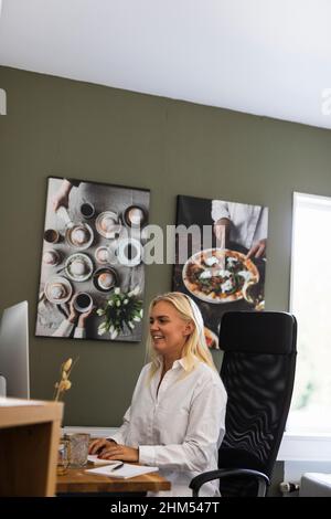 Woman using PC computer Stock Photo