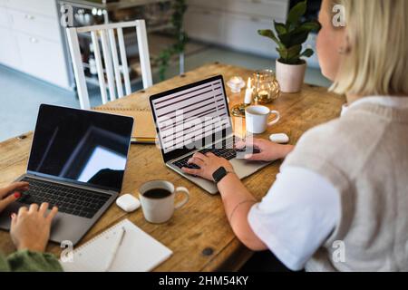 High angle view of women using laptops Stock Photo