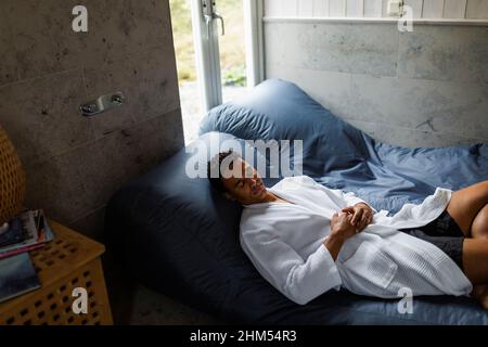 High angle view of man relaxing on bean bag Stock Photo